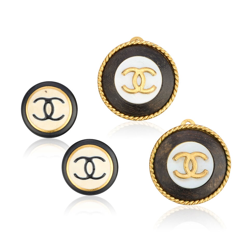 Chanel: Two Pairs of Round CC Clip Earrings Autumn 1993 and Autumn 1996: Chanel: Two Pairs of Round CC Clip Earrings Autumn 1993 and Autumn 1996 The first pair in mother-of-pearl and black wood with gold tone metal rope-twist border, 2.5cm diameter, the second pair in blac