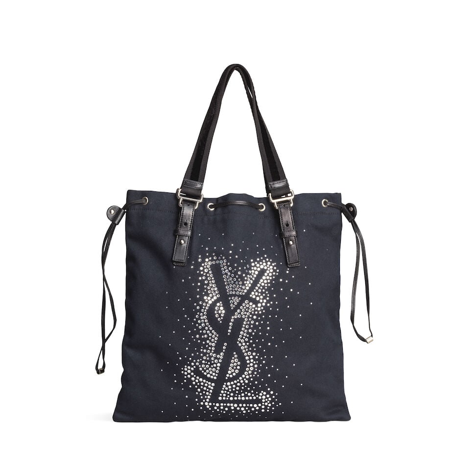 Yves Saint Laurent: a Black Kahala Crystal Tote early 2000s: Yves Saint Laurent: a Black Kahala Crystal Tote early 2000s Creative Director: Tom Ford Black canvas with crystal YSL design, black leather trim and drawstring closure Condition Grade B 37cm wide, 38c