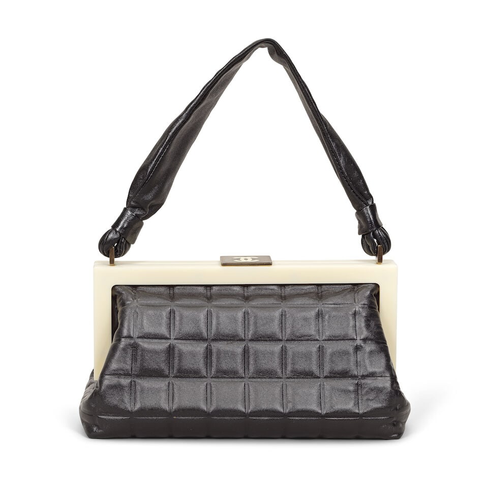 Chanel: a Black and White Frame Handbag 2000-02 (includes serial sticker and dust bag): Chanel: a Black and White Frame Handbag 2000-02 Creative Director: Karl Lagerfeld Chocolate bar square quilted black lambskin, with cream resin frame and silver tone CC clasp fastening Condition Grade