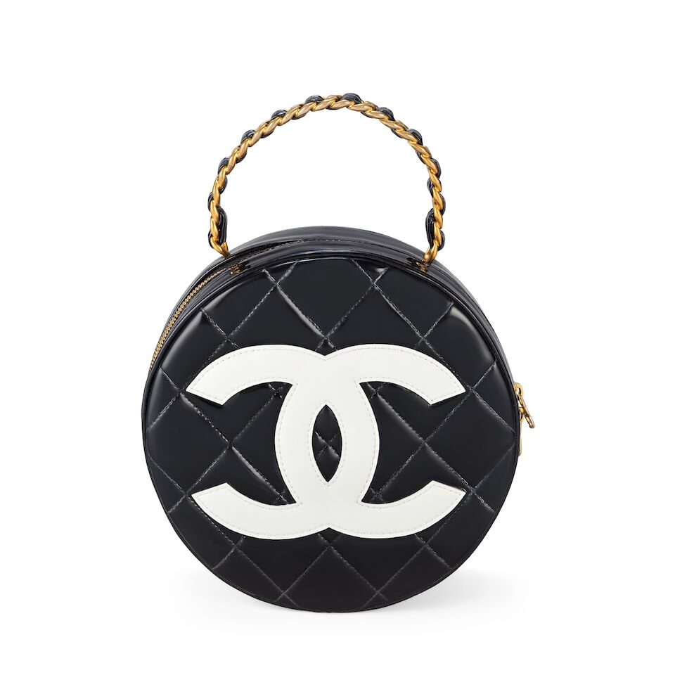Chanel: a Black and White Patent CC Round Vanity Case 'Barbie' Collection, Spring 1995 (includes...: Chanel: a Black and White Patent CC Round Vanity Case 'Barbie' Collection, Spring 1995 Creative Director: Karl Lagerfeld Leather threaded top handle, quilted patent leather with large CC at centre, go