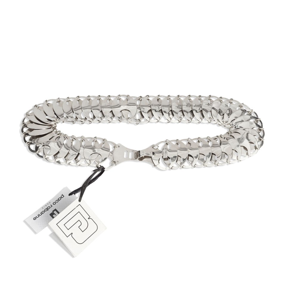 Paco Rabanne: a Silver Metal Waist Belt (includes tags): Paco Rabanne: a Silver Metal Waist Belt Silver tone metal discs with hook closure, after a 1976 design Condition Grade A- 80cm long, 6cm wide, includes tags For further information on this lot please