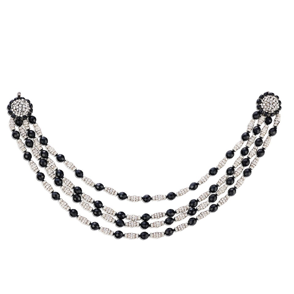 Chanel: a Black Glass and Crystal Multi-Strand Necklace Autumn 1995: Chanel: a Black Glass and Crystal Multi-Strand Necklace Autumn 1995 Creative Director: Karl Lagerfeld Four strands of black faceted glass beads interspersed with crystal spacers, hook fastening Condit