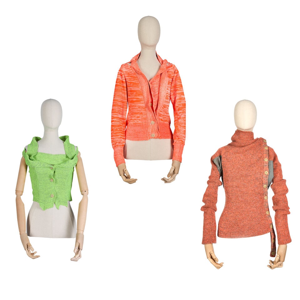 Vivienne Westwood: Three Knitted Day-Glo Tops Gold Label, early 2000s: Vivienne Westwood: Three Knitted Day-Glo Tops Gold Label, early 2000s To include an orange cardigan, a green top and an orange top with grey side panels and exaggerated neckline (3) Condition Grade A/