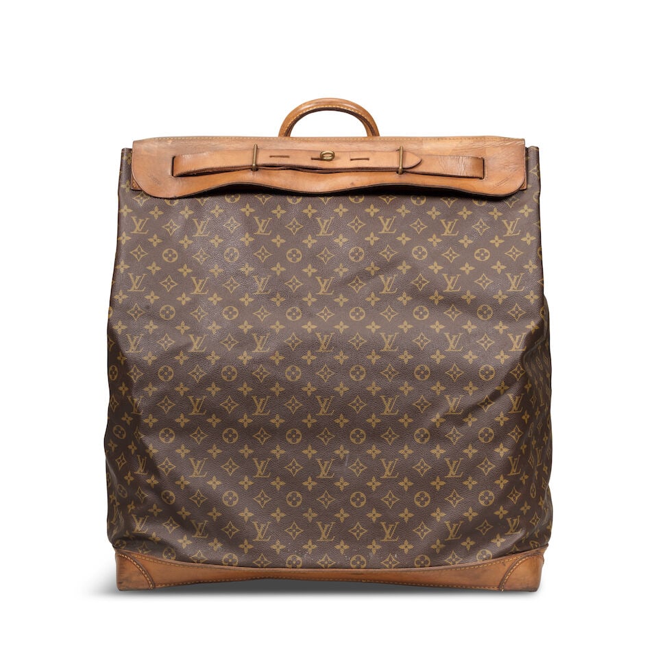 Louis Vuitton: a Monogram Steamer Bag 55 1970/80s (includes luggage tag): Louis Vuitton: a Monogram Steamer Bag 55 1970/80s Monogram canvas with vachetta leather trim and brass hardware Condition Grade C- 55cm wide, 55cm high, 26cm deep, includes luggage tag For further inf