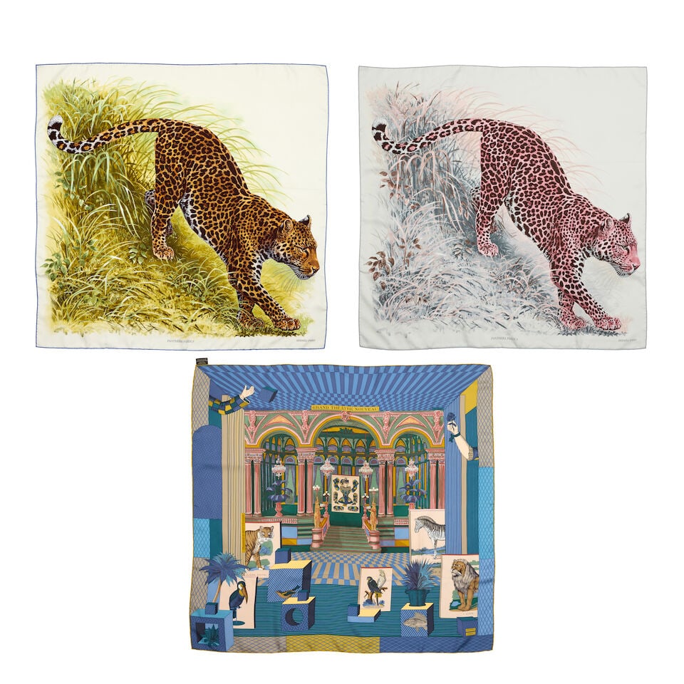 Hermès: Three Silk 90 Scarves: Hermès: Three Silk 90 Scarves To include two examples of 'Panthera Pardus', designed by Robert Dallet, on ivory ground, one with blue edge the other grey, and a 'Grand Theatre Nouveau' example, d