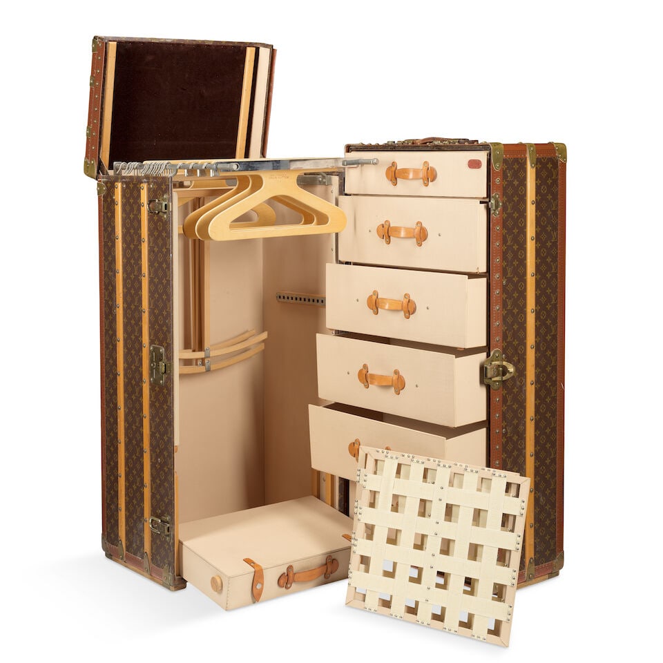 Louis Vuitton: a Large Monogram Malle Armoire Wardrobe Trunk c.1984 (includes two keys): Louis Vuitton: a Large Monogram Malle Armoire Wardrobe Trunk c.1984 Monogram canvas with leather trim, brass hardware and wooden struts, fully fitted interior with six drawers on one side, a lift out 