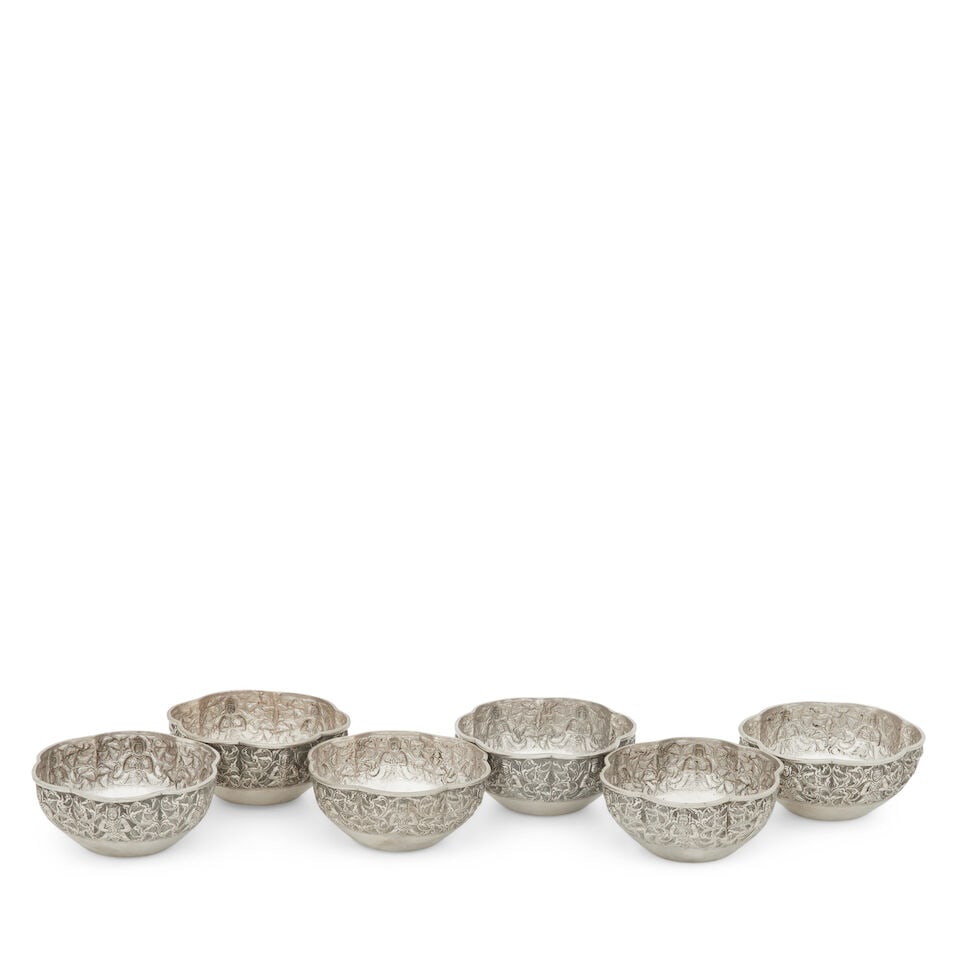 A set of six Chinese silver bowls circa 1900: A set of six Chinese silver bowls circa 1900 Of lobed circular form, the borders embossed with deities amongst scrolling foliage, each bearing two stamped character marks and numeral '2', 5cm high, 11