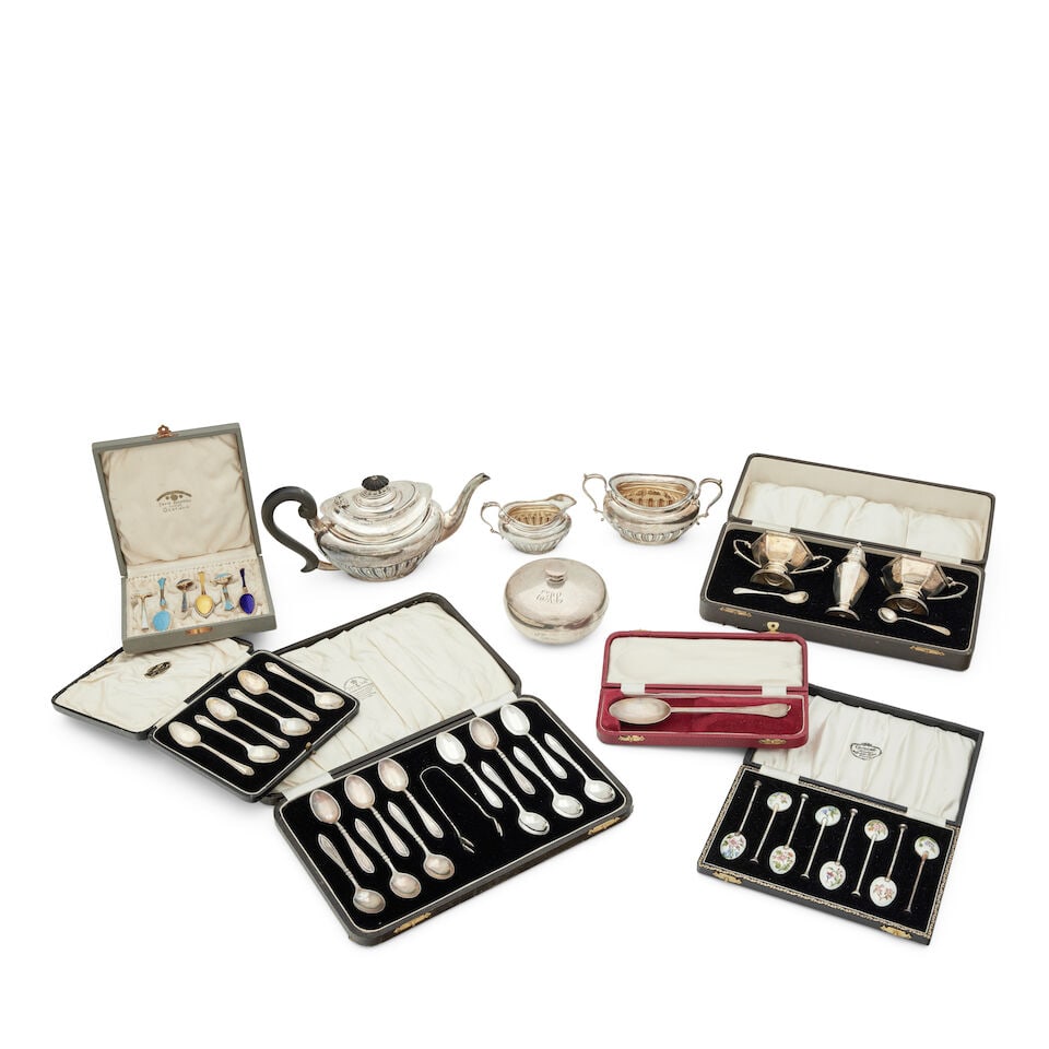 A silver Batchelor's tea set Martin Hall & Co, Sheffield 1906: A silver Batchelor's tea set Martin Hall & Co, Sheffield 1906 Of oval demi-gadrooned form, comprising a teapot, sugar and cream; together with a circular silver powder bowl and cover, six cased Norweg