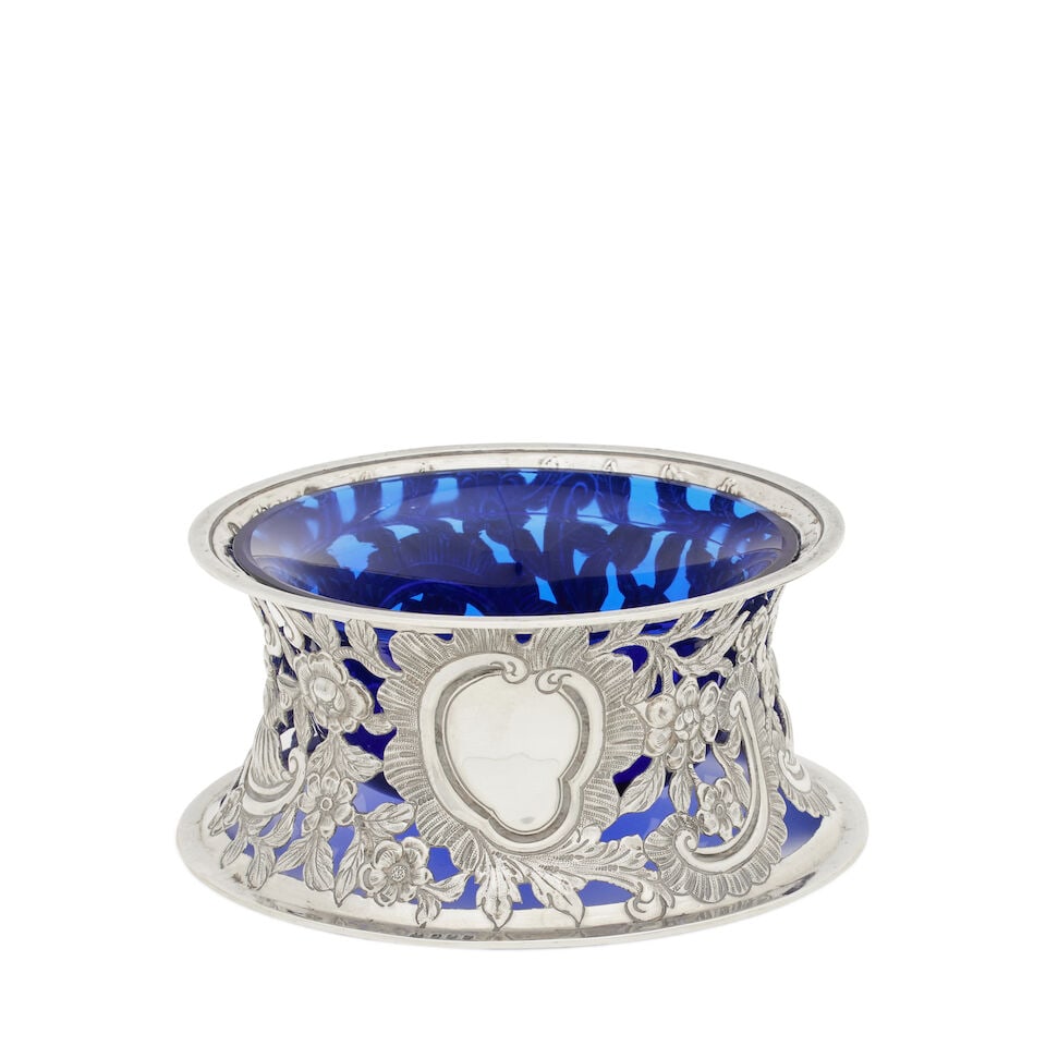 An Irish Victorian silver dish ring By West of Dublin, 1898: An Irish Victorian silver dish ring By West of Dublin, 1898 Of pierced capstan form, embossed and chased with scrolls, flowers and two figures, one holding a parasol, centred by a blank cartouche, blu