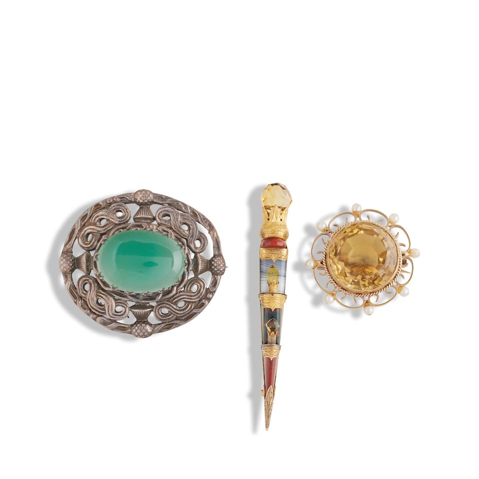 A Victorian Scottish hardstone dagger brooch and two other brooches (3): A Victorian Scottish hardstone dagger brooch and two other brooches The engraved gold mounted dagger brooch set with agate, bloodstone and jasper with facetted citrine terminals, 7.2cm long, unmarked;