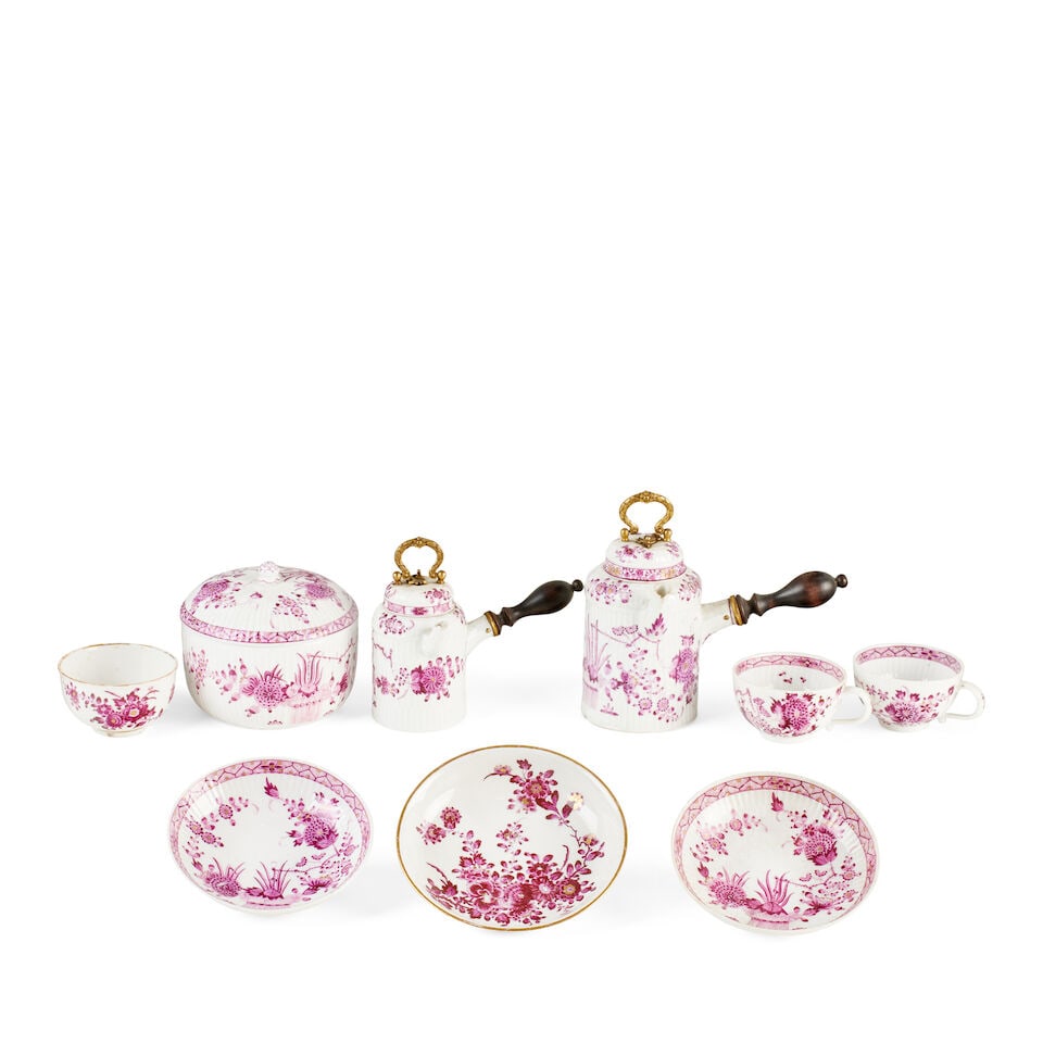 A Meissen porcelain part chocolate set 18th century: A Meissen porcelain part chocolate set 18th century Each piece with moulded ribbing and painted in puce with the sprays of flowers and comprising two graduated pots with side handles, a covered sucrie