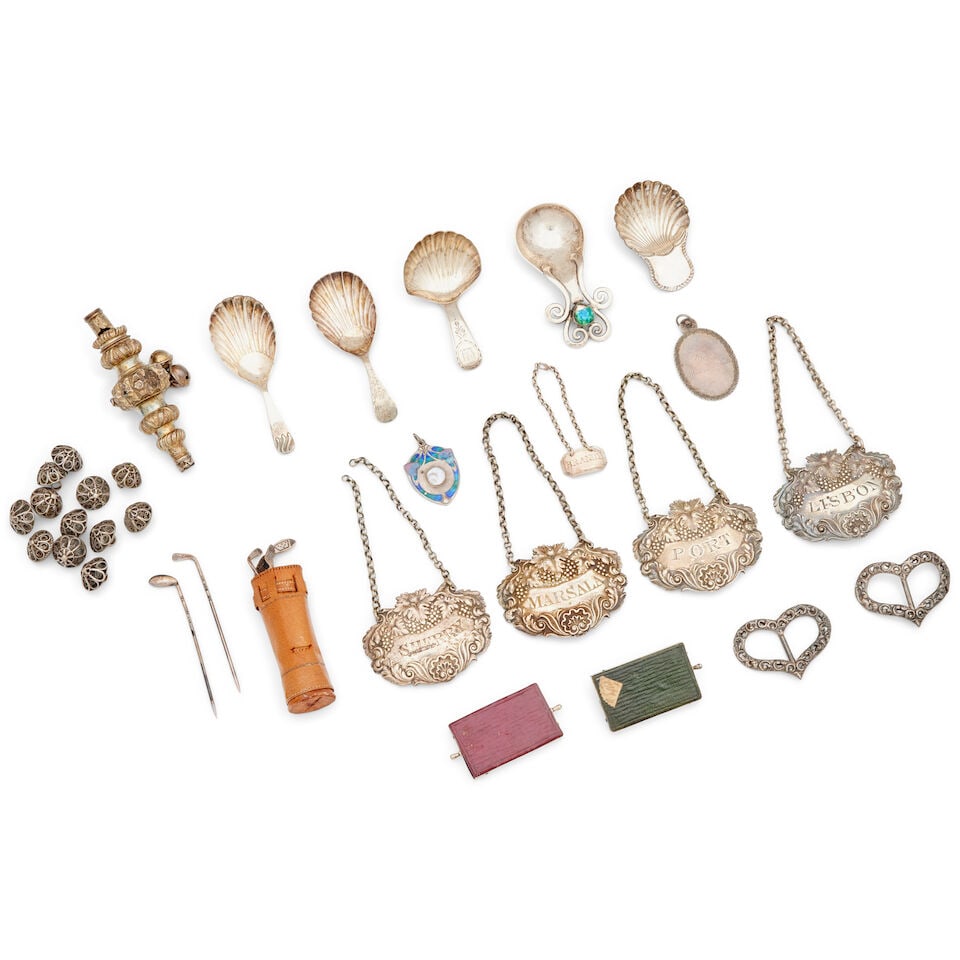 A collection of small silver items various makers and dates: A collection of small silver items various makers and dates Including a silver and blue enamel caddy spoon by Ramsden and Carr, London 1912, a set of four William IV decanter labels, Charles Reily & G