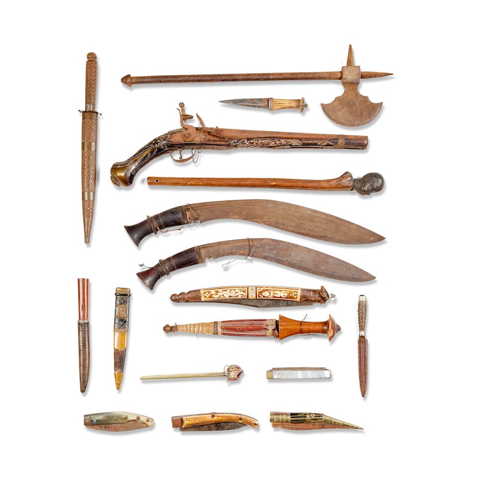 A collection of various 19th and 20th century items of arms and armour: A collection of various 19th and 20th century items of arms and armour Including a Indo Persian tabar steel with etched foliage designs, A 20 bore continental flintlock holster pistol late 18th centur