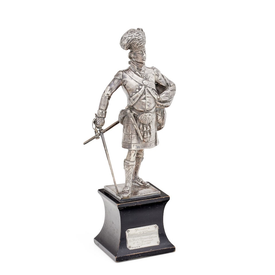 A silver model of an officer of a Highlanders Regiment Elkington & Co, Birmingham, 1921: A silver model of an officer of a Highlanders Regiment Elkington & Co, Birmingham, 1921 Shown standing in in dress uniform, on an ebonised base with presentation plaque inscribed Presented to Capt. D