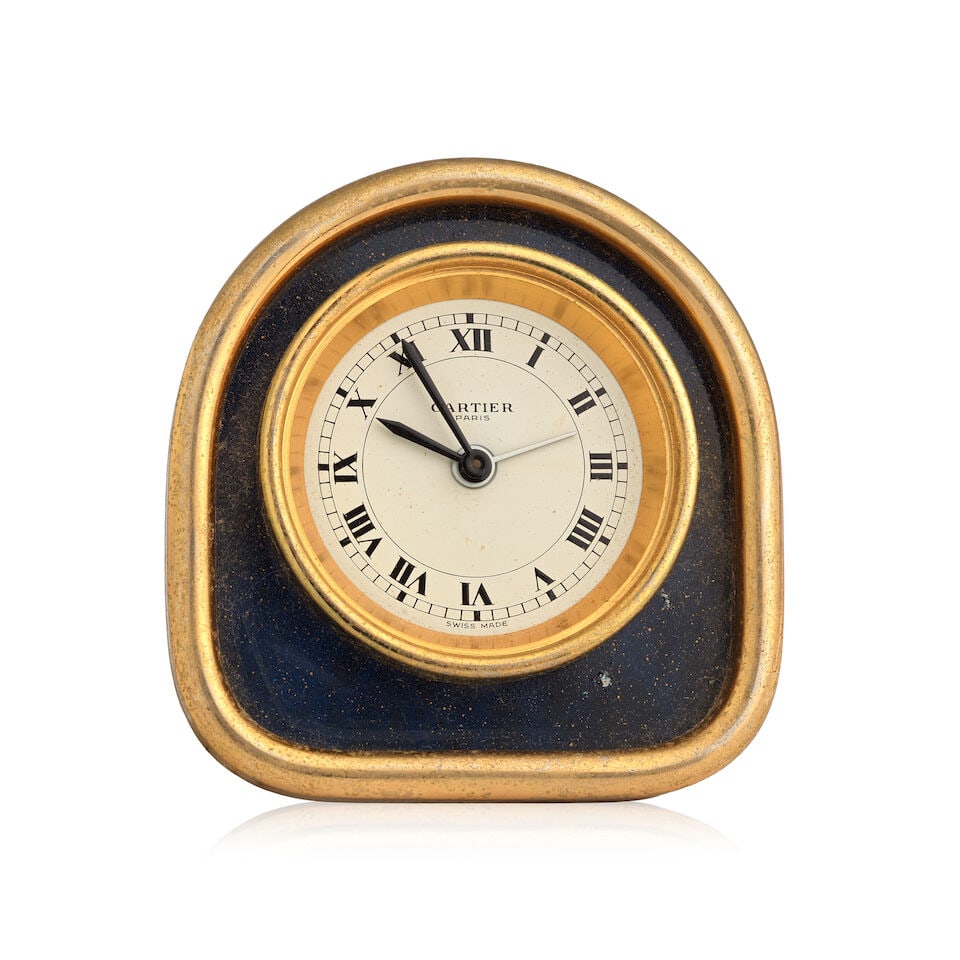 Cartier. A gilt brass manual wind desk clock with alarm and matching photo frame (AF) (2) Ref: 7... (1 of 2)