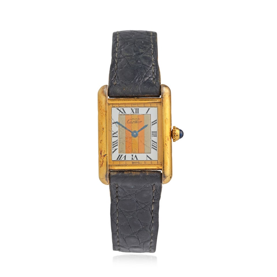 Cartier. A gold plated silver quartz rectangular wristwatch with 'trinity' dial Tank, Must de, ...: Cartier. A gold plated silver quartz rectangular wristwatch with 'trinity' dial Model: Tank, Must de Reference: 45774 Date: Circa 1990 Movement: 4-jewel Cal.057 quartz Dial: Mirrored tri-coloured cham