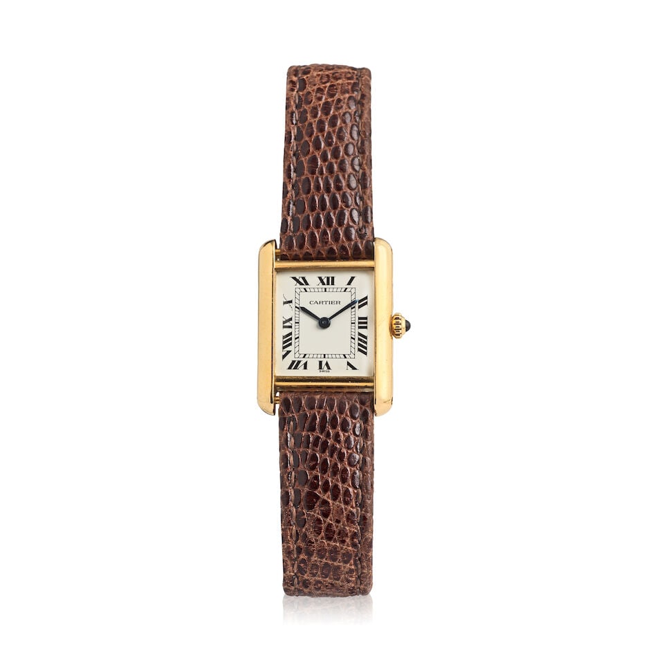 Cartier. An 18K gold quartz wristwatch Tank , Ref: 86600, Purchased 20th December 1989 (1 of 3)