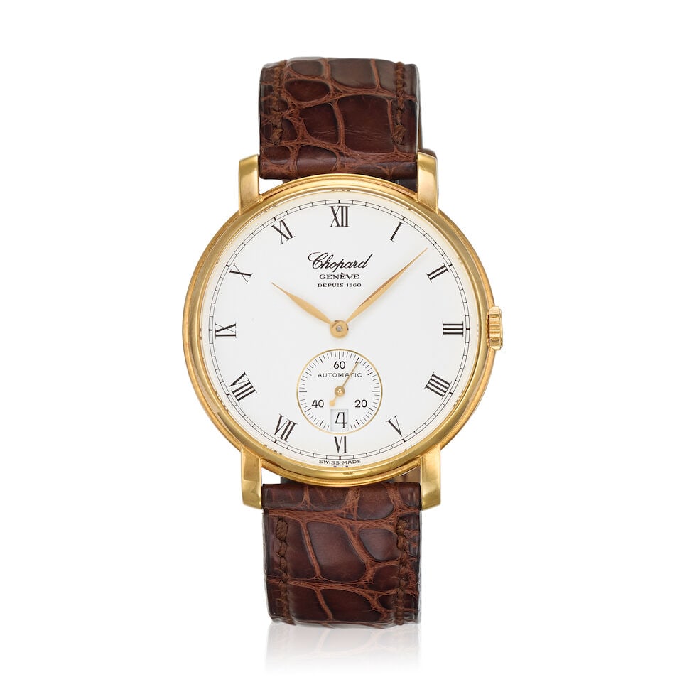 Chopard. An 18K gold automatic calendar wristwatch Ref: 16/1223, Circa 2000: Chopard. An 18K gold automatic calendar wristwatch Reference: 16/1223 Date: Circa 2000 Movement: 31-jewel Cal.1160 automatic, No.001134 Dial: White Case: Polished round, No.390111 Strap/Bracelet: