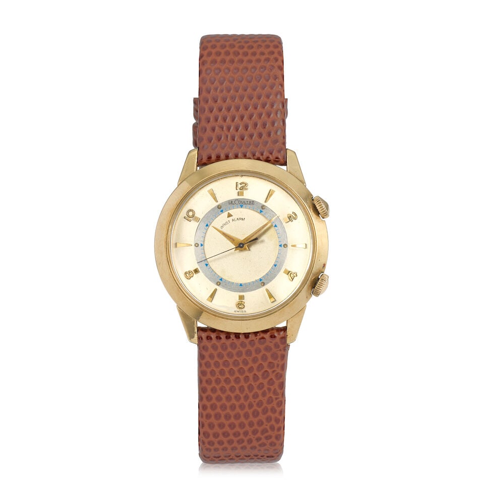 Le-Coultre. A 10K gold filled manual wind wristwatch with alarm Memovox , Circa 1960: Le-Coultre. A 10K gold filled manual wind wristwatch with alarm Model: Memovox Date: Circa 1960 Movement: 17-jewel Cal.814 manual wind, No.1099014 Dial: Two-tone silvered Case: Polished round, crowns