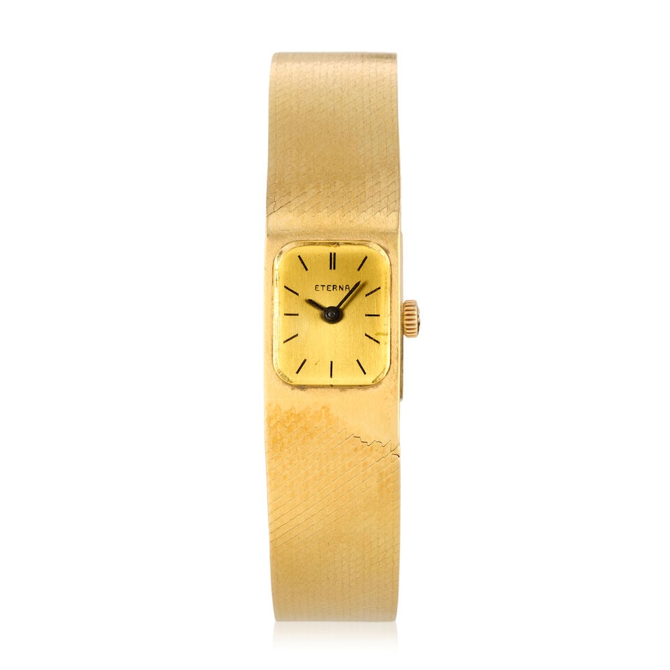 Eterna-Matic. A lady's 18K gold manual wind bracelet watch Circa 1970: Eterna-Matic. A lady's 18K gold manual wind bracelet watch Date: Circa 1970 Movement: 17-jewel Cal.1447K manual wind, No.6165373 Dial: Champagne Case: Brushed and polished rectangular, No.6 167 333 St