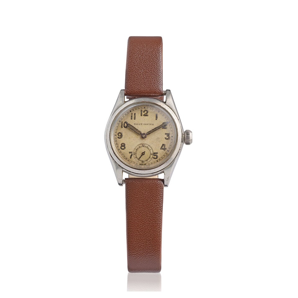 Rolex. A stainless steel manual wind wristwatch Ref: 3121, Circa 1941: Rolex. A stainless steel manual wind wristwatch Reference: 3121 Date: Circa 1941 Movement: 15-jewel manual wind Dial: Silvered Case: Polished tonneau form, No.115904 Strap/Bracelet: Associated