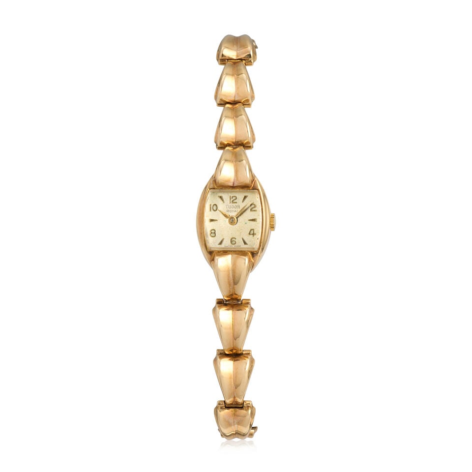 Tudor. A lady's 9K gold manual wind bracelet watch Royal, Chester Hallmark for 1954: Tudor. A lady's 9K gold manual wind bracelet watch Model: Royal Date: Chester Hallmark for 1954 Movement: 17-jewel manual wind Dial: Silvered Case: Polished tonneau form, No.187696 Strap/Bracelet: