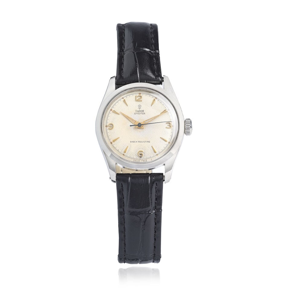 Tudor. A stainless steel manual wind wristwatch Oyster , Ref: 7903, Circa 1965: Tudor. A stainless steel manual wind wristwatch Model: Oyster Reference: 7903 Date: Circa 1965 Movement: 17-jewel Cal.1182 manual wind Dial: Textured silvered Case: Polished tonneau form,