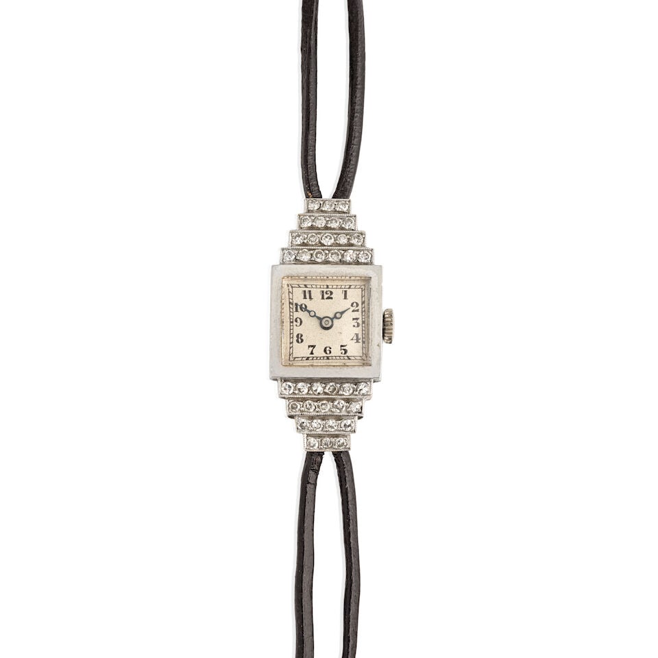 Vertex. A lady's platinum and diamond set manual wind bracelet watch Circa 1942: Vertex. A lady's platinum and diamond set manual wind bracelet watch Date: Circa 1942 Movement: 15-jewel manual wind Dial: Silvered Case: Polished square form, diamond set bezel, personal inscription 