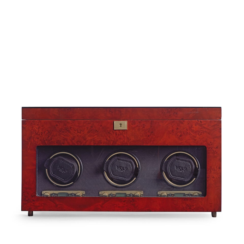 WOLF. A wooden electronic watch winder Circa 2015: WOLF. A wooden electronic watch winder Including three winding modules, five watch storage slots and a travel case Date: Circa 2015 Size: 46.5cm wide x 20.5cm deep x 26cm high Accompaniments: Key,