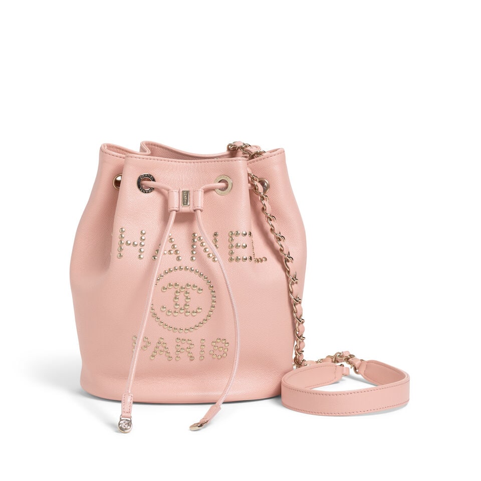 CHANEL: PINK CAVIAR DEAUVILLE DRAWSTRING BUCKET BAG 2019: CHANEL: PINK CAVIAR DEAUVILLE DRAWSTRING BUCKET BAG 2019 • Pink Caviar Leather Exterior • Studded Chanel Logo Detail • Gold Tone Hardware • Logo Drawstring Closure • Pink
