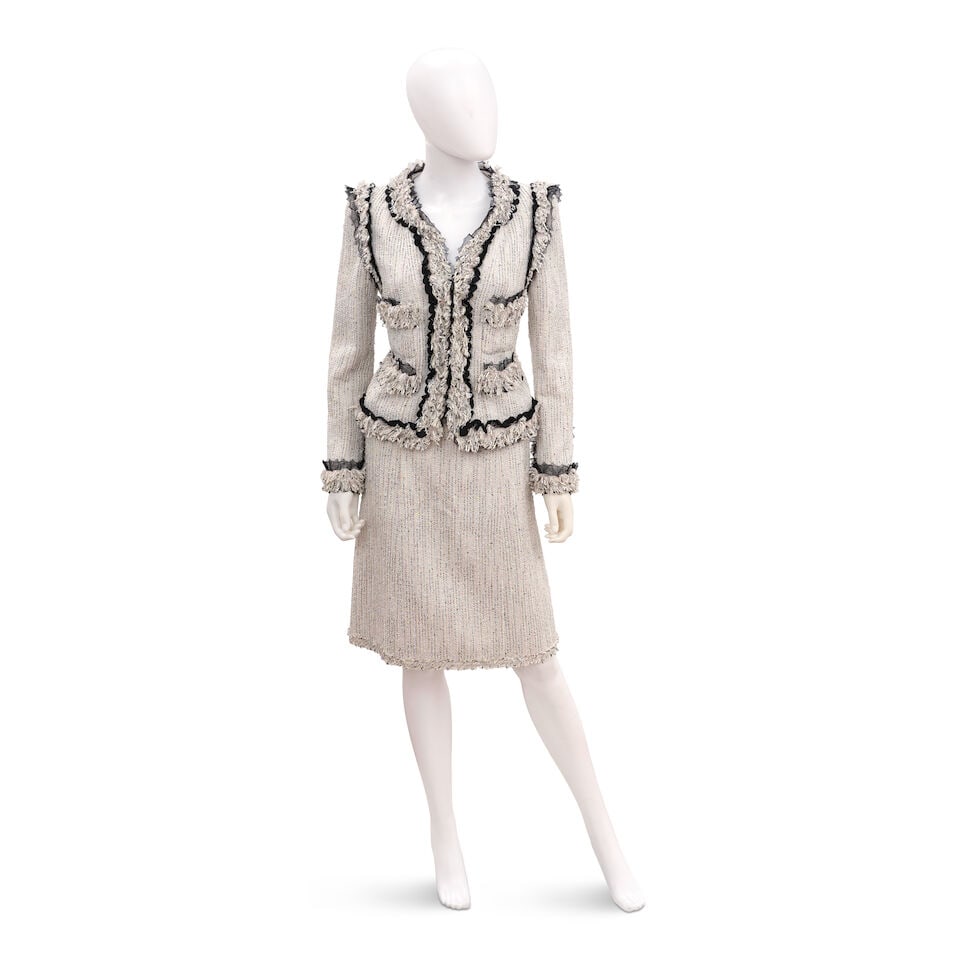 CHANEL: BLACK AND WHITE BOUCLE SKIRT SUIT ENSEMBLE Spring 2005 | Look 13: CHANEL: BLACK AND WHITE BOUCLE SKIRT SUIT ENSEMBLE Spring 2005 | Look 13 • Black and White Cotton Wool Tweed Exterior • Pastel Embroidery and Sequin Detail Throughout • Raw Hem, Blac
