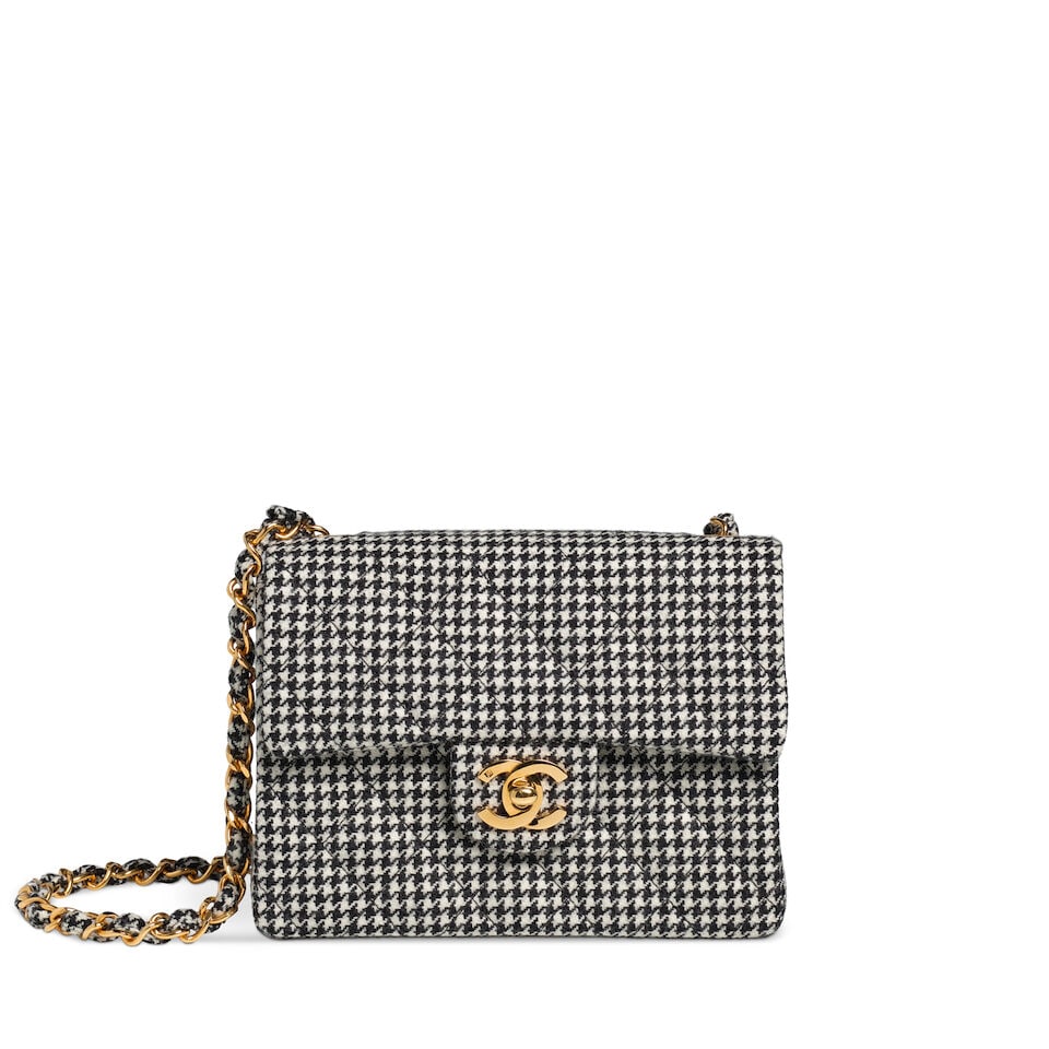 CHANEL: HOUNDSTOOTH WOOL MINI SQUARE FLAP 1990's: CHANEL: HOUNDSTOOTH WOOL MINI SQUARE FLAP 1990's • Black and White Wool Quilted Houndstooth Exterior • Gold Tone Hardware • Wool and Chain Shoulder Strap • Exterior Patch Pocke