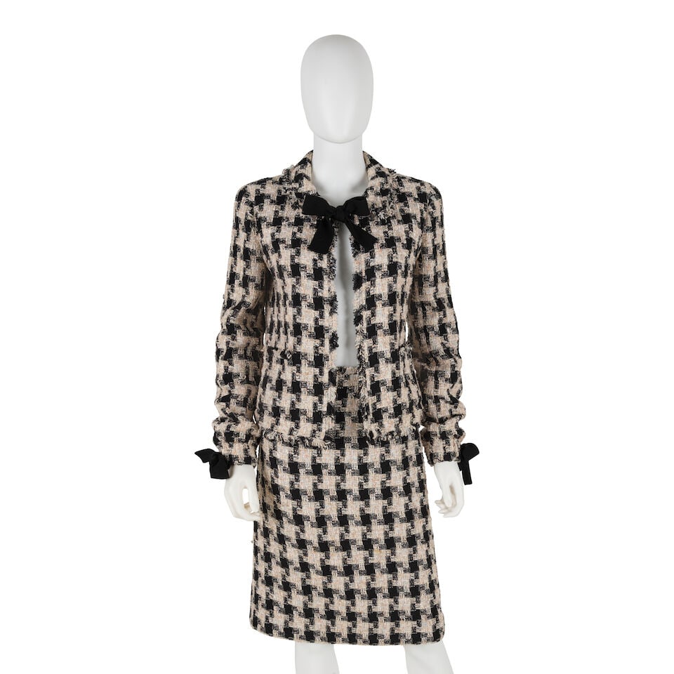 CHANEL: BLACK AND PASTEL PLAID TWEED SKIRT SUIT ENSEMBLE Fall 2004: CHANEL: BLACK AND PASTEL PLAID TWEED SKIRT SUIT ENSEMBLE Fall 2004 • Black and Multicolor Pastel Textured Plaid Tweed Exterior • Black Knit Ribbon Bow Detail at Cuffs • Elastic Cuffs