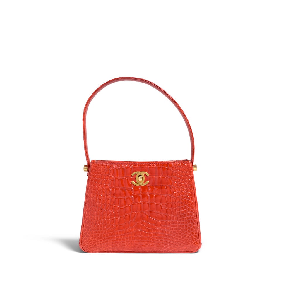 CHANEL: ORANGE ALLIGATOR DOUBLE SIDED CC TURNLOCK TOP HANDLE MINI 1996-1997: CHANEL: ORANGE ALLIGATOR DOUBLE SIDED CC TURNLOCK TOP HANDLE MINI 1996-1997 • Orange Alligator Exterior • Gold Tone Hardware • Single Flat Top Handle • Dual Sided CC Turn Lock 