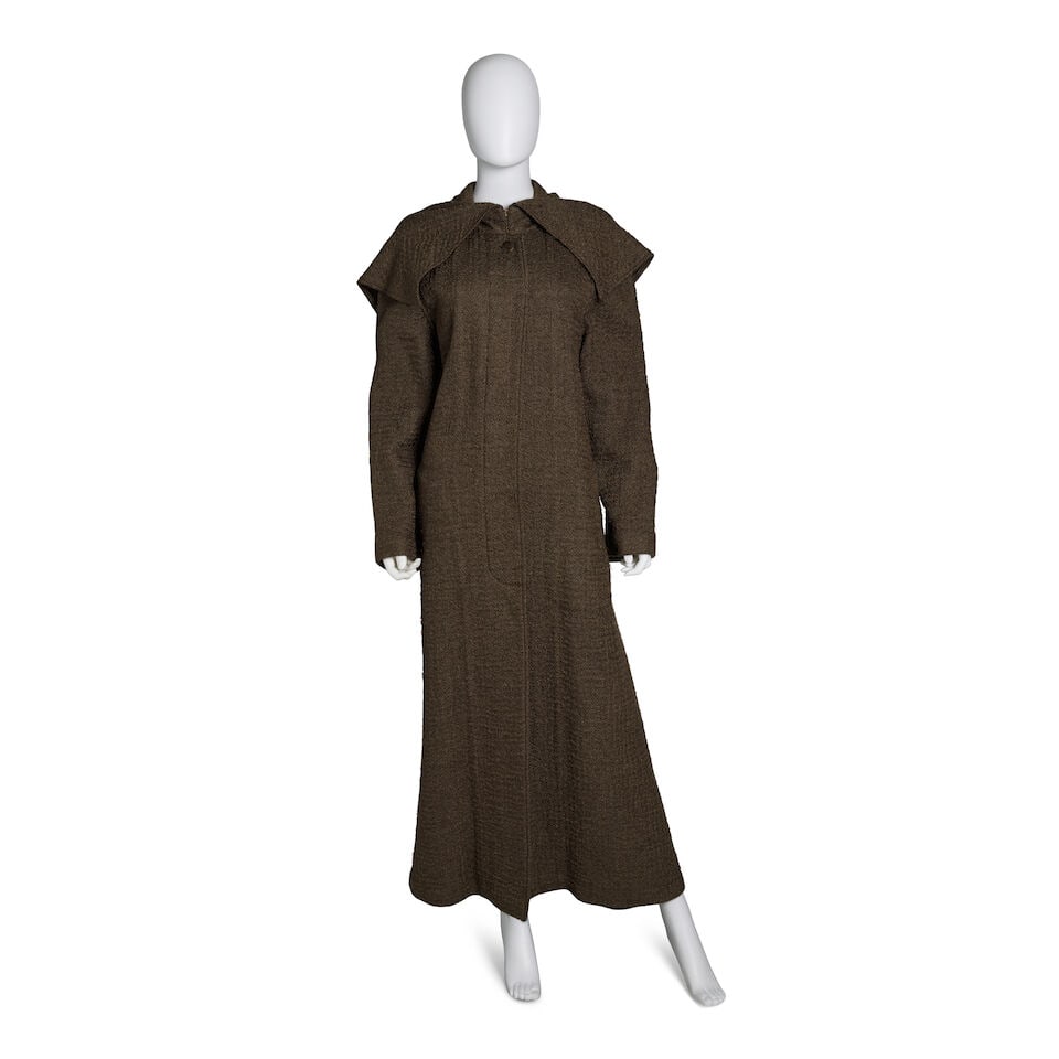 CHANEL: OLIVE BROWN WOOL OVERSIZED HOODED COAT Fall 1999 | Look 15: CHANEL: OLIVE BROWN WOOL OVERSIZED HOODED COAT Fall 1999 | Look 15 • Olive Brown Wool Blend Exterior • Exaggerated Hood Attached • Button Closure • Zipper and Brass Buttons at 