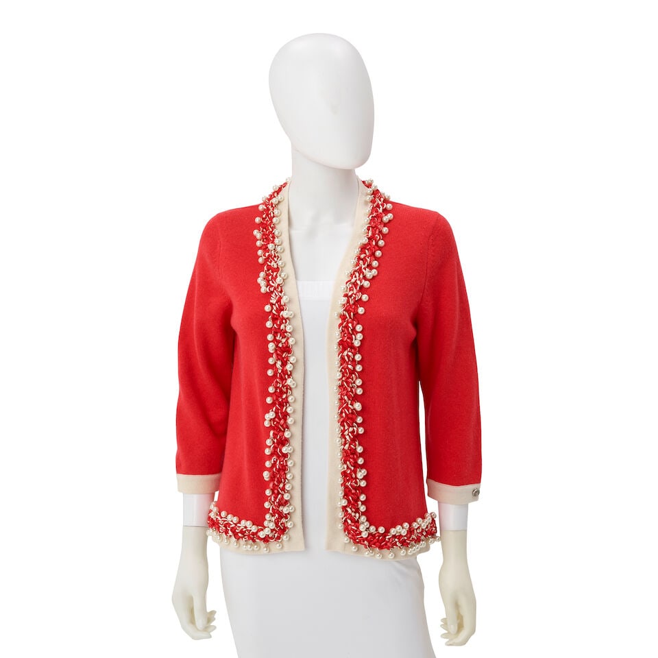 CHANEL: RED CASHMERE SWEATER WITH PEARL AND ROPE TRIM Spring 2010: CHANEL: RED CASHMERE SWEATER WITH PEARL AND ROPE TRIM Spring 2010 • Red Cashmere Exterior with White Trim • Multicolor Rope Trim with Dangling Pearl Detail Embellishments • Open Fron