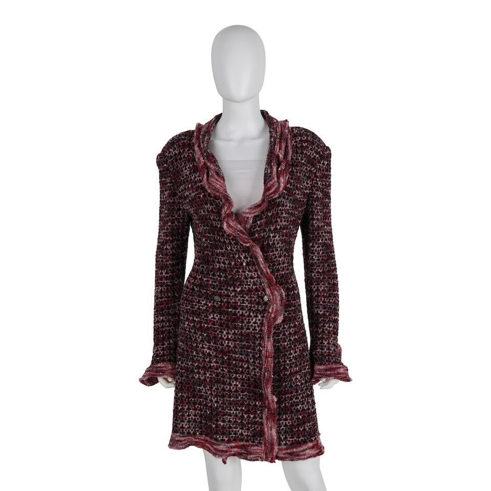 CHANEL: BLACK & PINK RUFFLE KNIT CARDIGAN Fall 1997: CHANEL: BLACK & PINK RUFFLE KNIT CARDIGAN Fall 1997 • Black and Pink Blend Knit Exterior with Lurex Detail • Pink Ruffle Trim • Button Closure • No Interior Lining • Mark