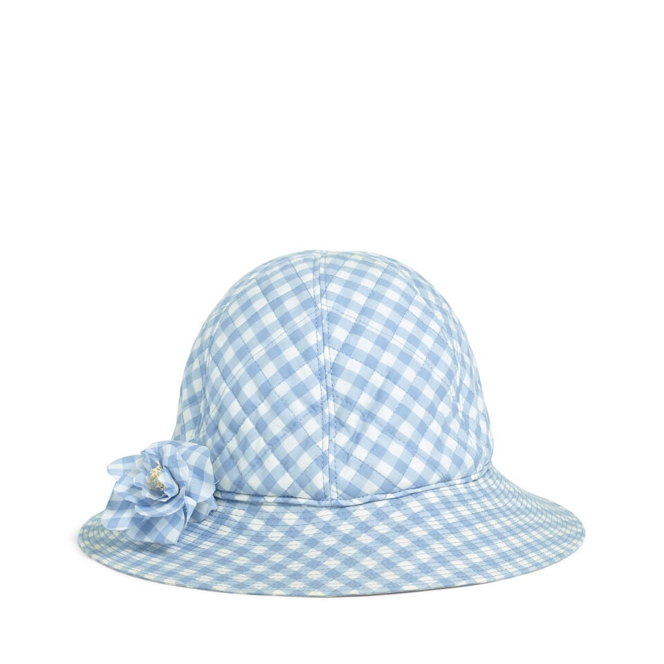 CHANEL: BLUE GINGHAM BUCKET HAT Mid 1990's: CHANEL: BLUE GINGHAM BUCKET HAT Mid 1990's • Includes Cotton Camellia Pin • Marked Size 57 For further information on this lot please visit Bonhams.com For further information about this l