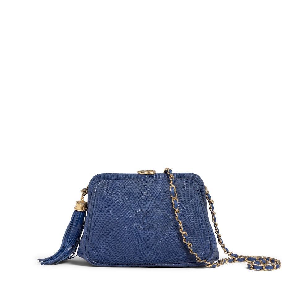 CHANEL: BLUE LIZARD CC TASSEL FRAME BAG 1986-1988: CHANEL: BLUE LIZARD CC TASSEL FRAME BAG 1986-1988 • Blue Lizard Quilted Exterior with CC Logo Stitch Detail • Gold Tone Hardware • Leather and Chain Shoulder Strap with Tassel Detail
