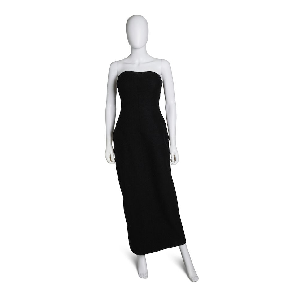 CHANEL: BLACK STRAPLESS DRESS Fall 1999: CHANEL: BLACK STRAPLESS DRESS Fall 1999 • Black Wool Exterior • Two Front Pockets • Zipper Closure • Sleeve Detail • Black Silk CC Interior Lining • Marked Size 40 