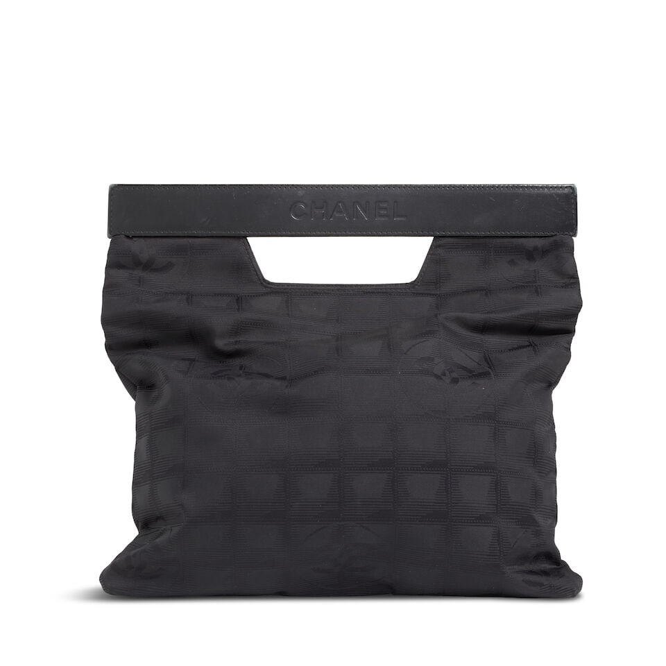 CHANEL: BLACK TRAVEL LIGNE FOLDOVER CLUTCH 2002-2003: CHANEL: BLACK TRAVEL LIGNE FOLDOVER CLUTCH 2002-2003 • Black CC Logo Nylon Exterior • Leather Frame Closure with Cutout Detail • Nylon Lined Interior with Zipper Pocket • Measu
