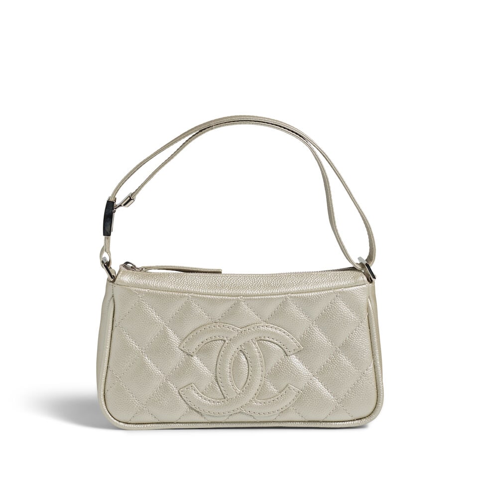 CHANEL: SILVER CAVIAR QUILTED TIMELESS POCHETTE 2005-2006: CHANEL: SILVER CAVIAR QUILTED TIMELESS POCHETTE 2005-2006 • Silver Quilted Caviar Leather Exterior • Exterior CC Patch Detail • Silver Tone Hardware • Adjustable Leather Should