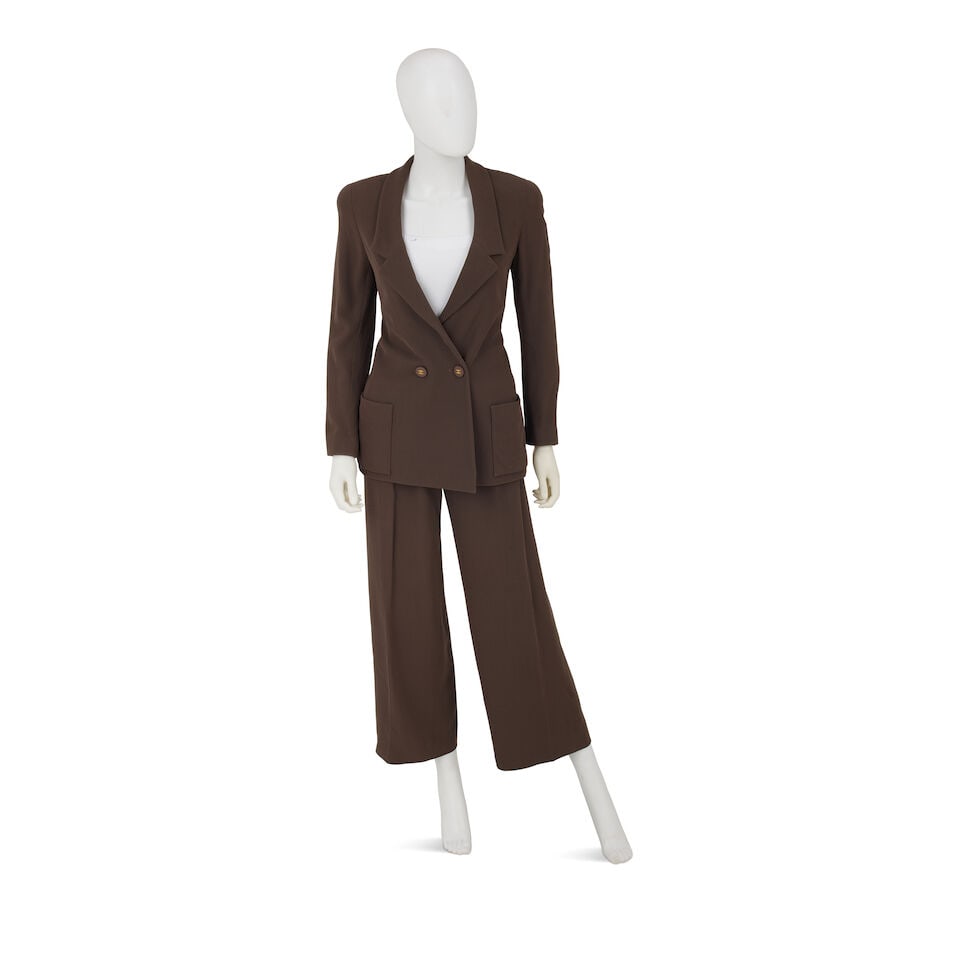 CHANEL: OLIVE WOOL SUIT Fall 1994: CHANEL: OLIVE WOOL SUIT Fall 1994 • Olive Brown Wool Exterior • Button and Zipper Closure • Olive Brown CC Silk Lining • Pants Marked Size 38 | Jacket No Marked Size, Fits like