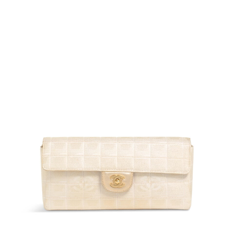 CHANEL: METALLIC QUILTED TRAVEL LIGNE EAST/WEST SHOULDER BAG 2000-2002: CHANEL: METALLIC QUILTED TRAVEL LIGNE EAST/WEST SHOULDER BAG 2000-2002 • Cream and Metallic Gold Quilted Nylon Exterior • Gold Tone Hardware • Optional Nylon and Chain Shoulder Strap