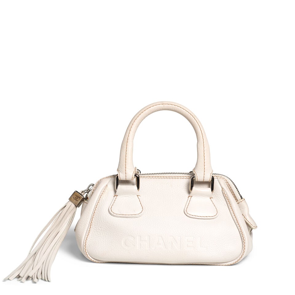 CHANEL: BEIGE CAVIAR LEATHER LAX SMALL BOWLER BAG 2003-2004: CHANEL: BEIGE CAVIAR LEATHER LAX SMALL BOWLER BAG 2003-2004 • Beige Caviar Leather Exterior with Brown Stitch Detailing • Silver Tone Hardware • Dual Rolled Handles • Zipper Cl