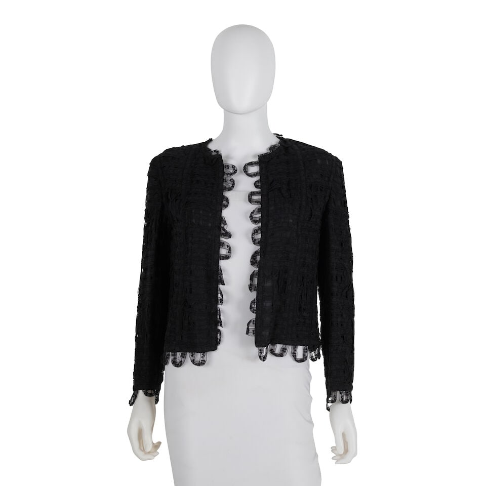 CHANEL: BLACK LACE CROPPED JACKET 2000 Transition Collection: CHANEL: BLACK LACE CROPPED JACKET 2000 Transition Collection • Black Lace Exterior • Black Silk Interior Lining • Marked Size 40 For further information on this lot please visit Bonh
