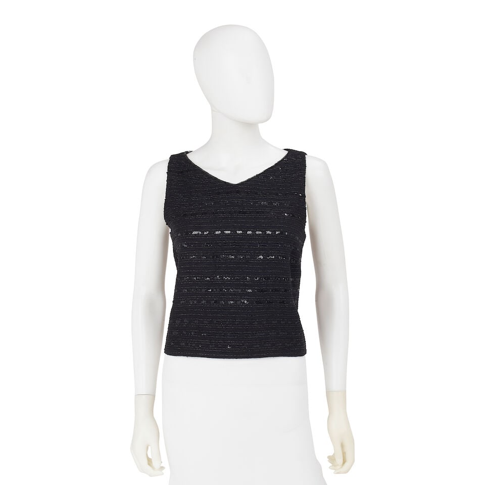 CHANEL: BLACK TWEED EMBELLISHED SHELL Cruise 2000: CHANEL: BLACK TWEED EMBELLISHED SHELL Cruise 2000 • Black Wool Blend Exterior with Sequin and Lurex Detail • Button Back Closure • Marked Size 42 For further information on this lot 
