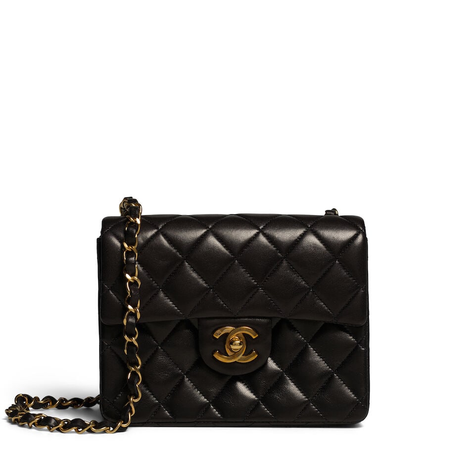 CHANEL: BLACK LAMBSKIN QUILTED SQUARE MINI FLAP BAG 1994-1996: CHANEL: BLACK LAMBSKIN QUILTED SQUARE MINI FLAP BAG 1994-1996 • Black Quilted Lambskin Leather Exterior • Gold Tone Hardware • Leather and Chain Shoulder Strap • Exterior Patch