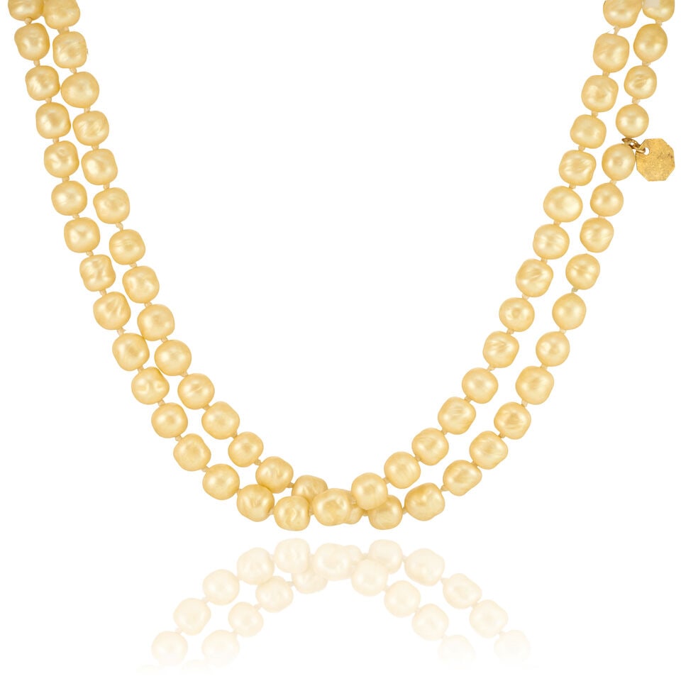 CHANEL: STRAND OF FAUX PEARLS 1984: CHANEL: STRAND OF FAUX PEARLS 1984 • Simulated Pearl Strand • No Closure • Measures 55 cm Drop For further information on this lot please visit Bonhams.com For further information ab