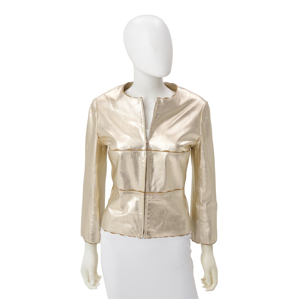 CHANEL: METALLIC GOLD GOATSKIN JACKET Cruise 2000: CHANEL: METALLIC GOLD GOATSKIN JACKET Cruise 2000 • Metallic Gold Calfskin Exterior • Logo Zip Closure • Silk Interior Lining • Marked Size 42 For further information on this l